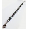 Bracelet hématites et perles noires à spirales argentées.